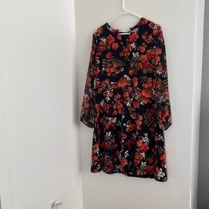 Knee length dress black with orange flowers.